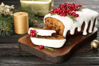 Traditional Christmas cake on black wooden table. Classic recipe