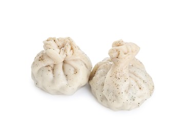 Photo of Two tasty khinkali (dumplings) and spices isolated on white. Georgian cuisine