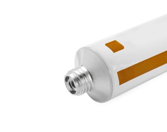 Open tube of ointment on white background, closeup. Space for text
