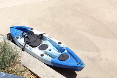Photo of Beautiful bright kayak outdoors, above view. Space for text