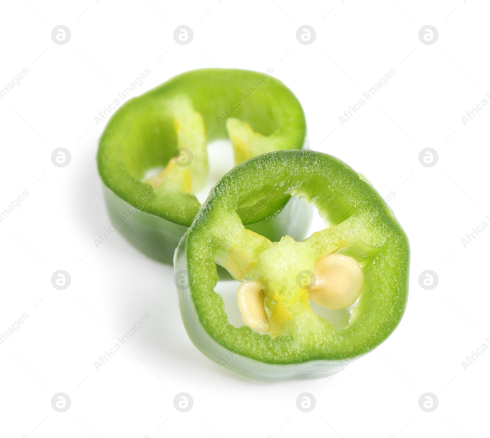 Photo of Cut green hot chili pepper on white background