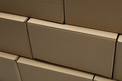 Photo of Stackmany closed cardboard boxes as background