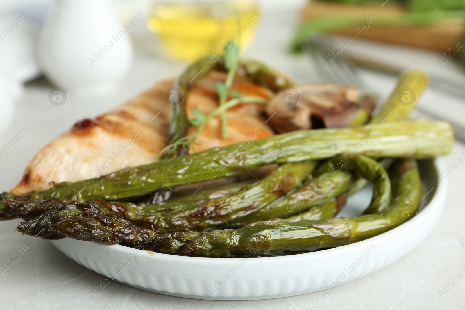 Photo of Tasty asparagus with meat on plate, closeup