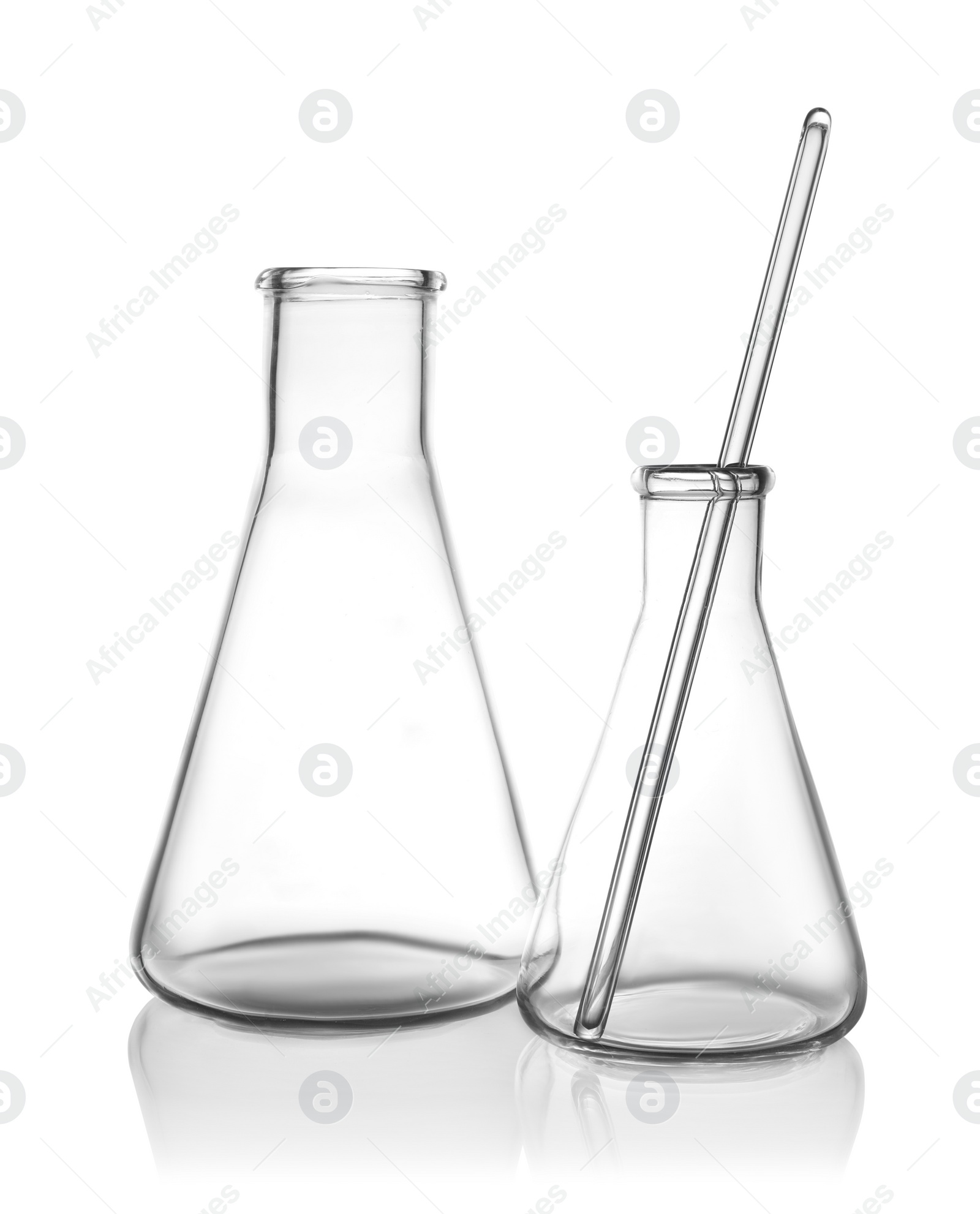 Photo of Clean empty laboratory glassware on white background