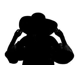 Silhouette of woman in hat on white background, back view