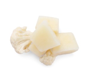 Photo of Frozen cauliflower puree cubes and fresh cauliflower isolated on white, top view