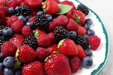 Photo of Different fresh ripe berries on table, closeup