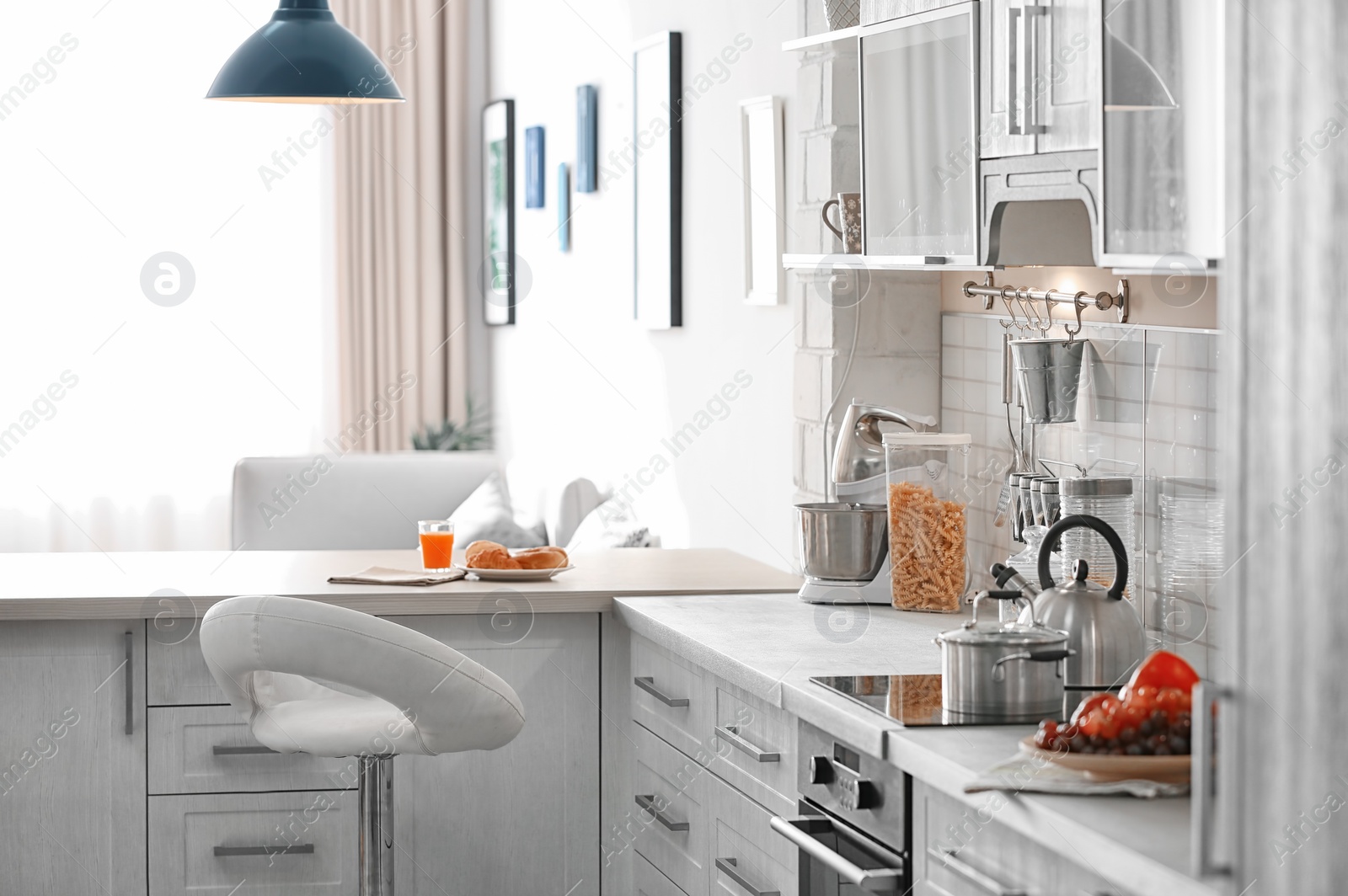 Photo of Modern kitchen interior in light apartment