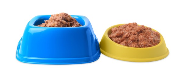 Photo of Wet pet food in feeding bowls on white background