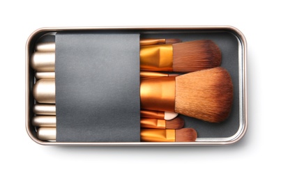 Photo of Box with makeup brushes of professional artist on white background