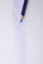 Photo of Purple pencil on sheet of paper with drawing, top view