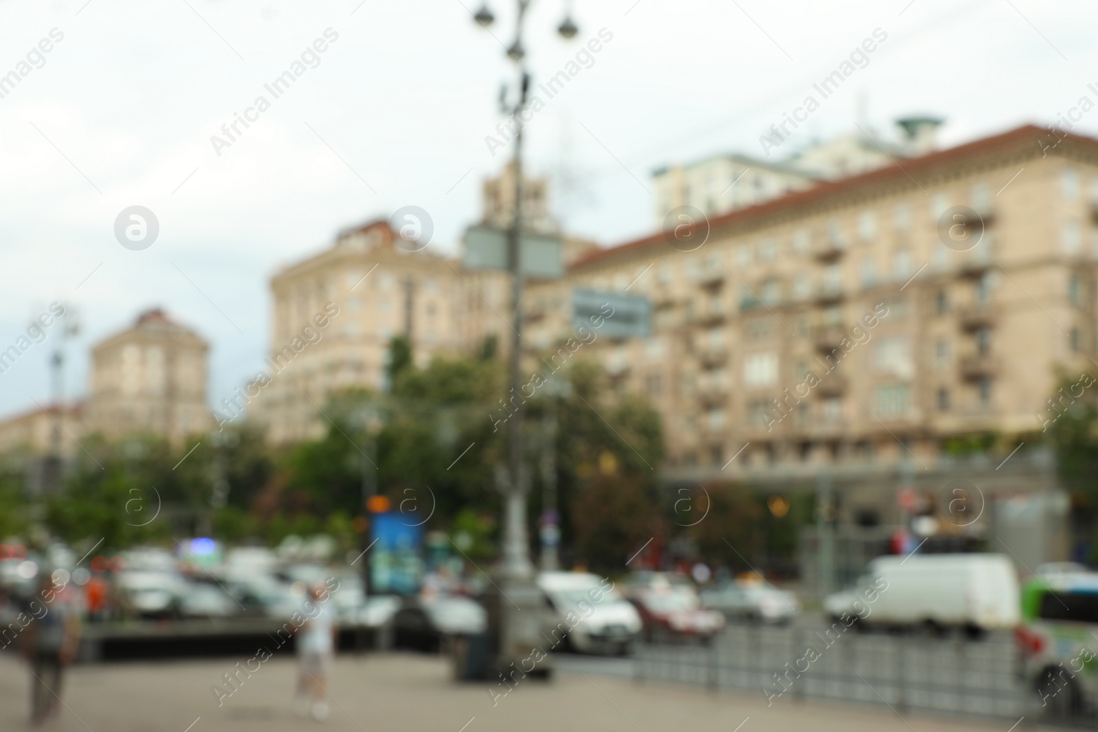 Photo of KYIV, UKRAINE - MAY 21, 2019: Blurred view of cityscape and street traffic