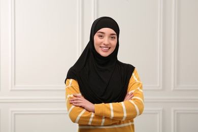 Portrait of Muslim woman in hijab indoors
