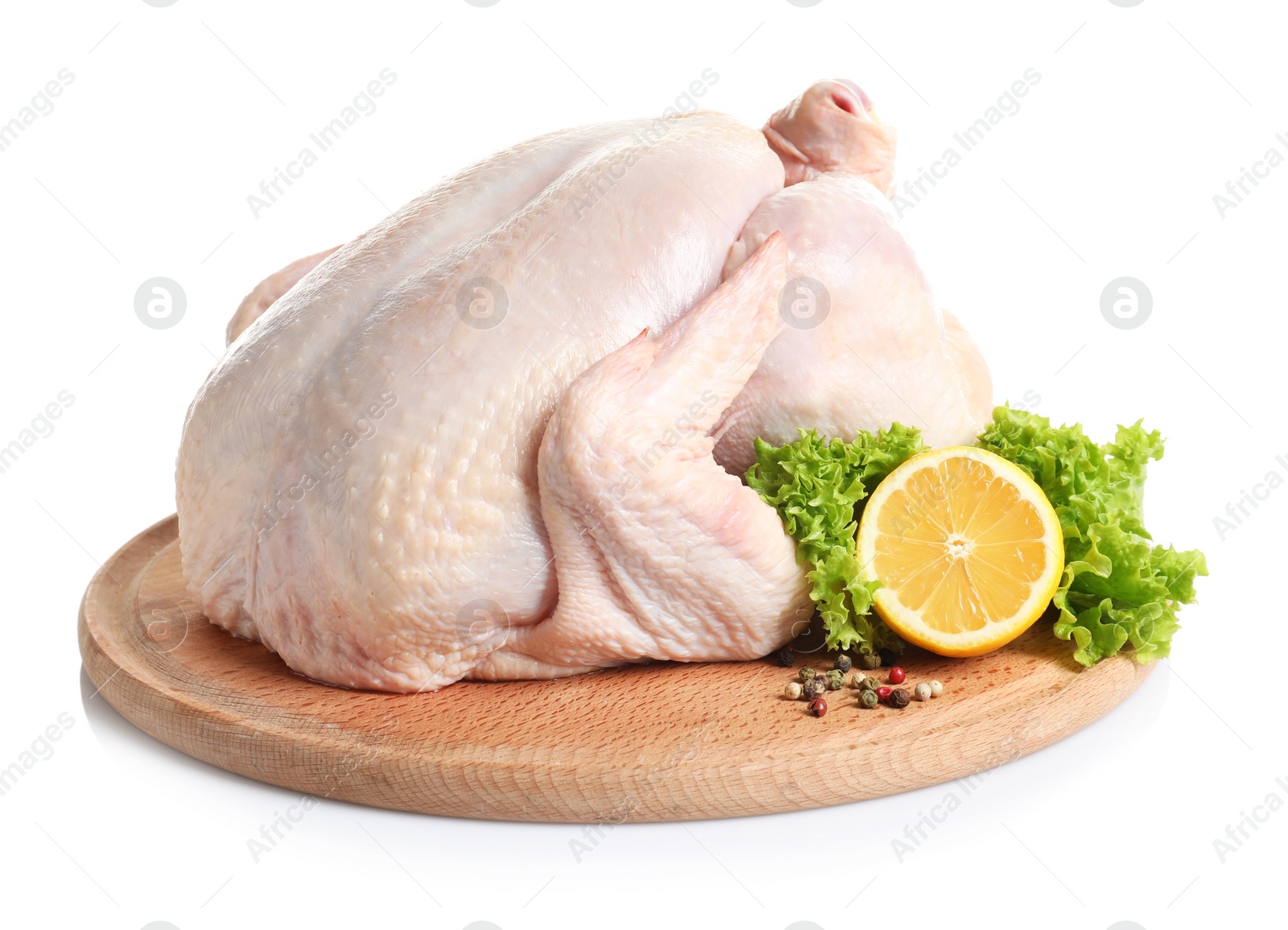 Photo of Wooden board with raw turkey and ingredients on white background