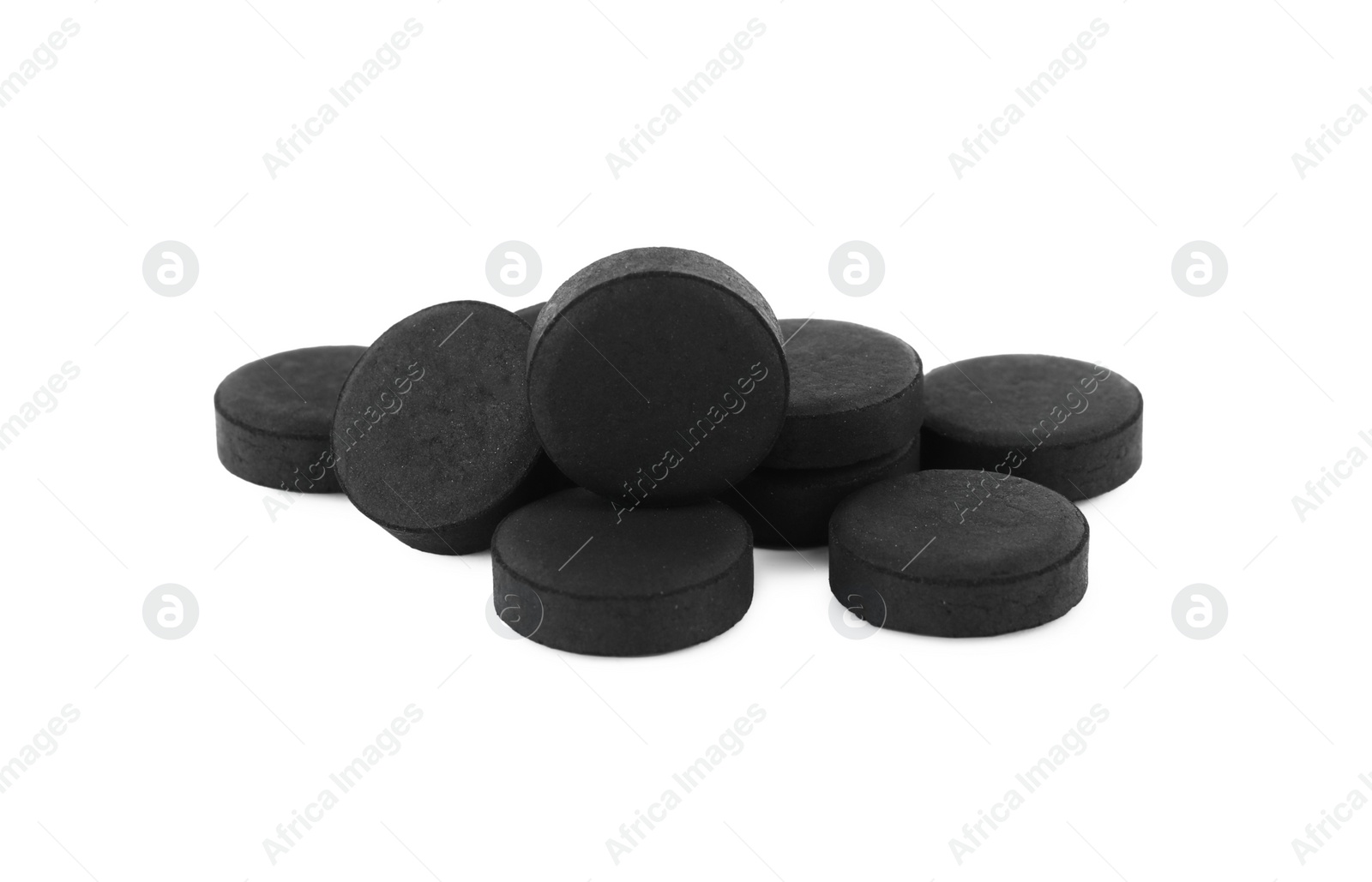 Photo of Activated charcoal pills on white background. Potent sorbent