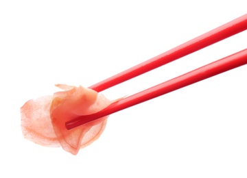 Photo of Chopsticks with pickled ginger on white background