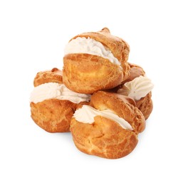 Photo of Delicious profiteroles with cream filling on white background