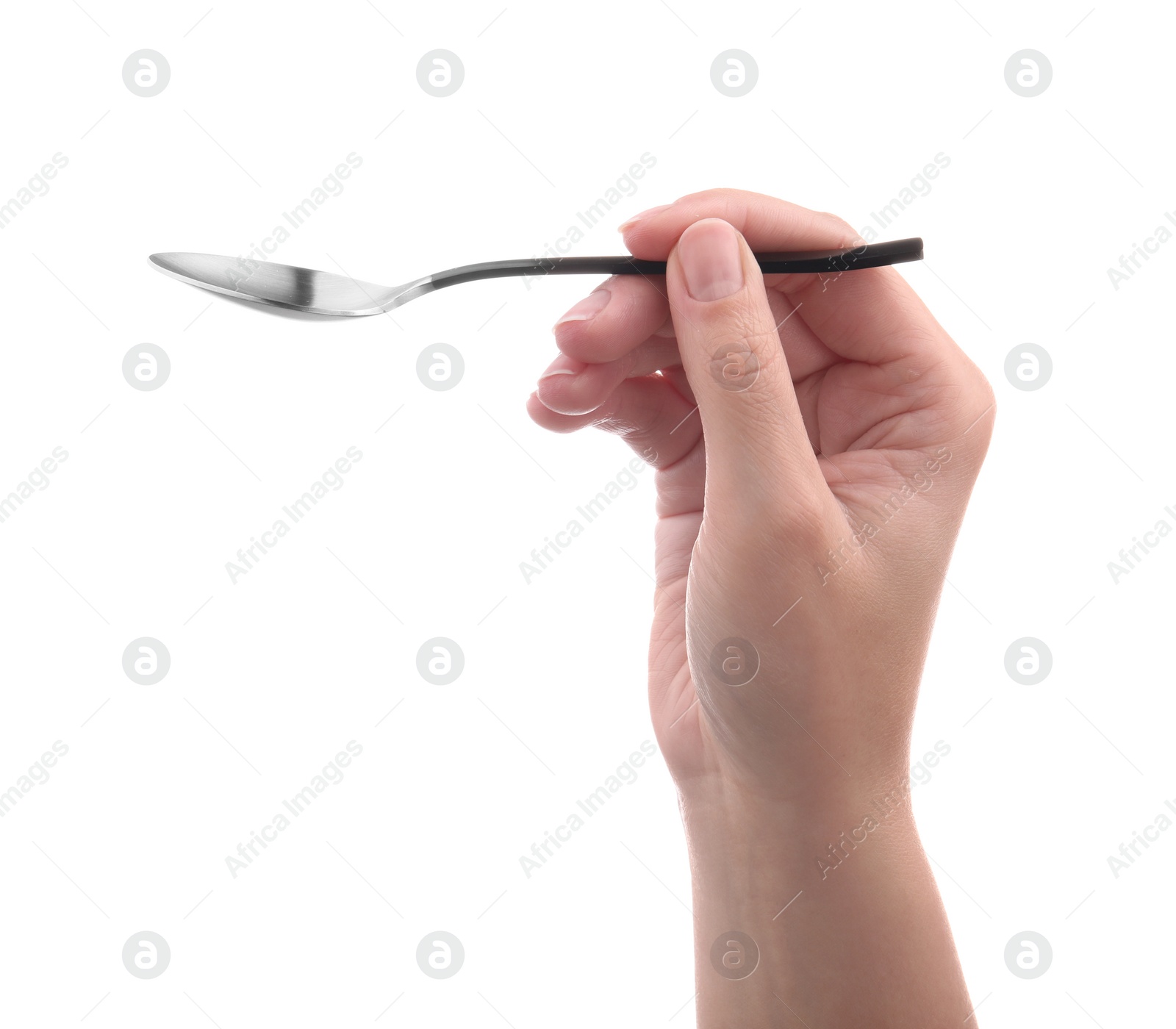 Photo of Woman holding new shiny spoon on white background, closeup