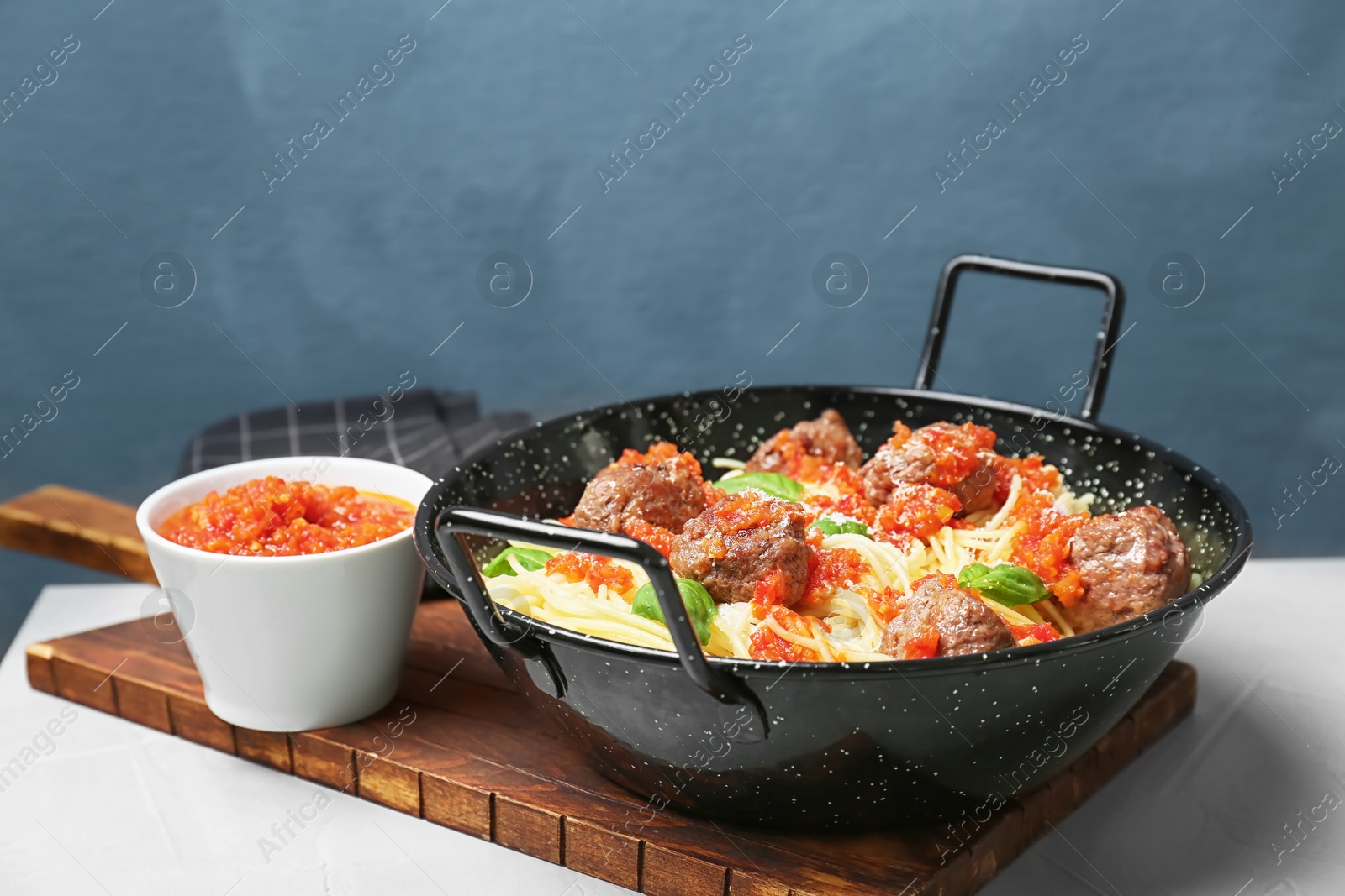 Photo of Pasta with meatballs and tomato sauce on table