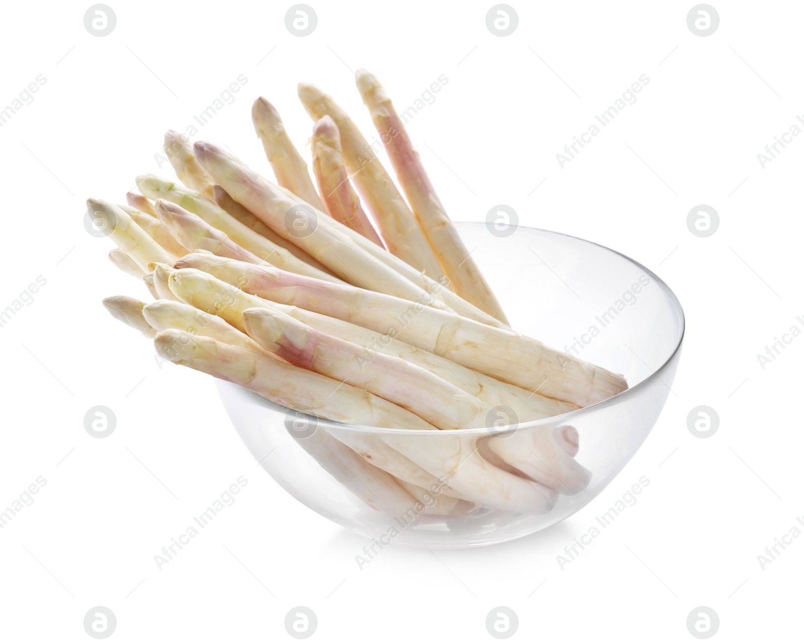 Photo of Fresh raw asparagus in glass bowl isolated on white