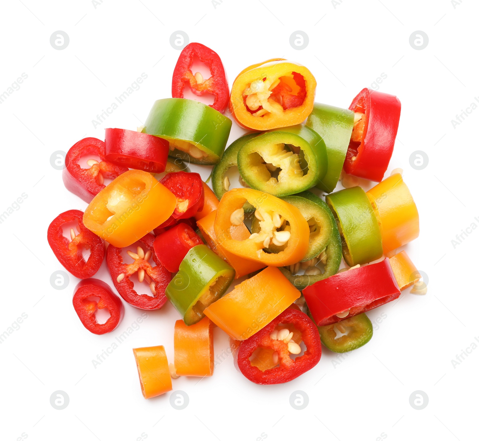 Photo of Pile of different cut hot chili peppers on white background, top view