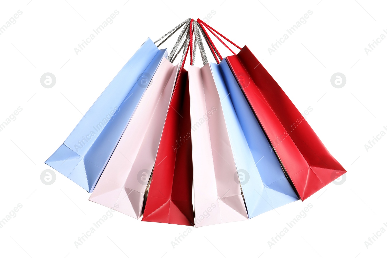 Photo of Colorful paper shopping bags on white background