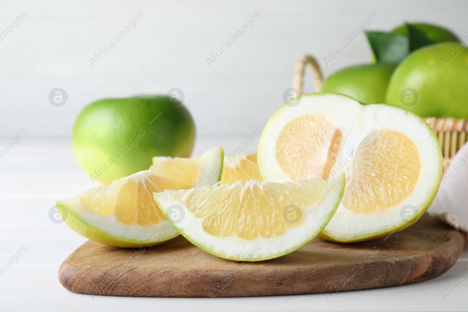 Photo of Cut fresh juicy sweetie on white table