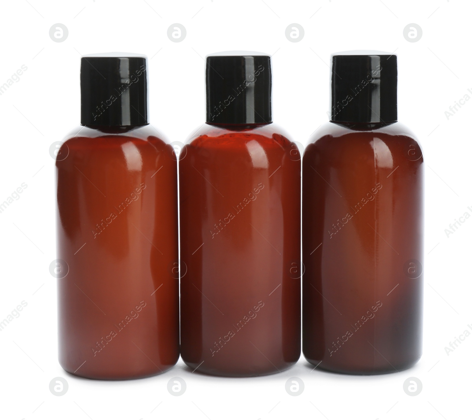 Photo of Mini bottles with cosmetic products on white background. Hotel amenities