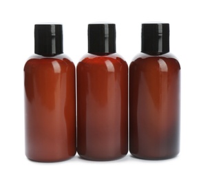 Photo of Mini bottles with cosmetic products on white background. Hotel amenities