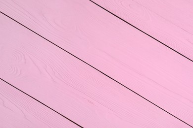 Photo of Texture of pink wooden surface as background, closeup