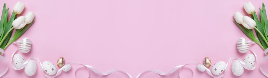 Image of Flat lay composition with decorated Easter eggs and flowers on pink background, space for text. Banner design