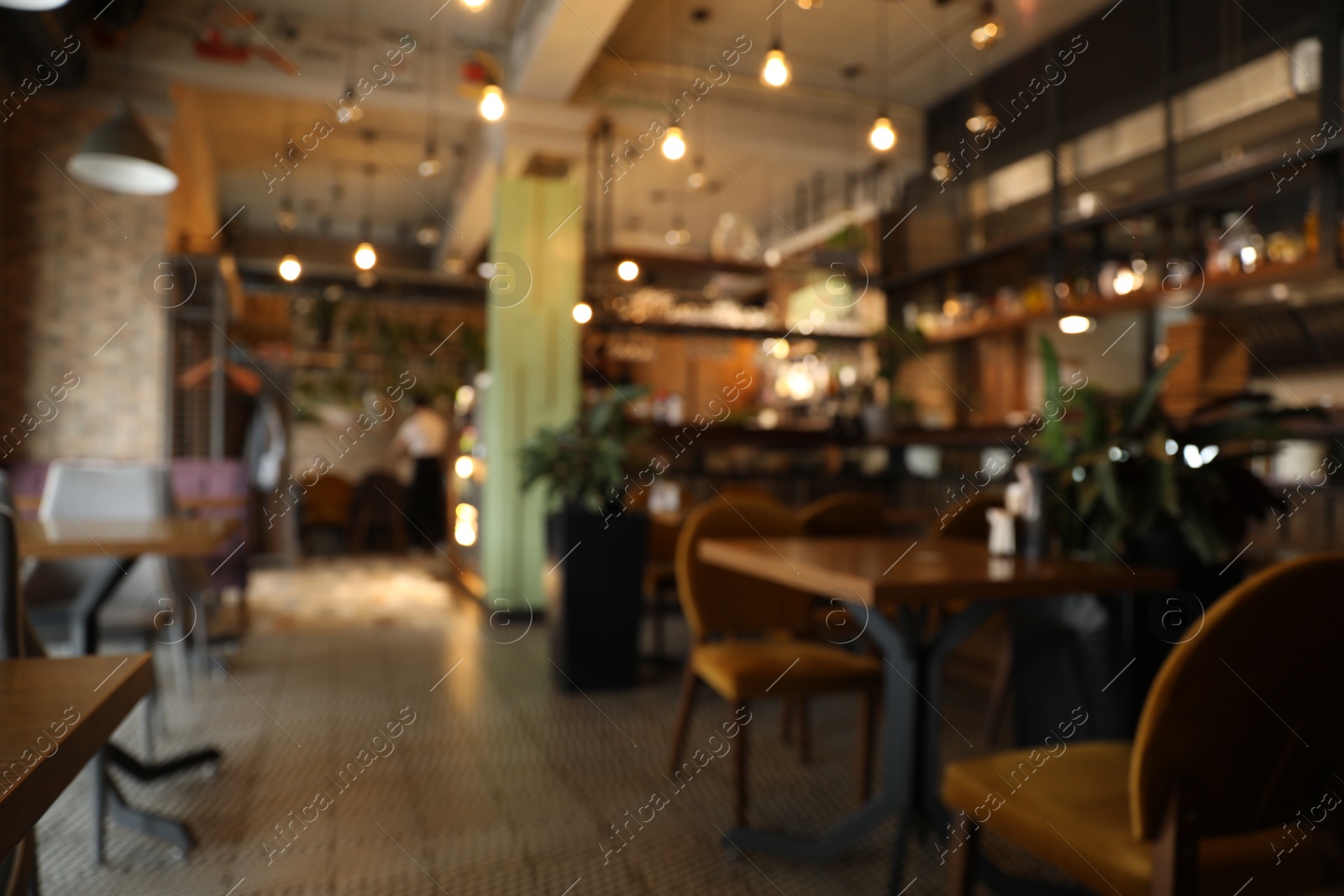 Photo of Blurred view of stylish modern cafe interior with bokeh effect