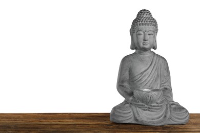 Photo of Beautiful stone Buddha sculpture on wooden table against grey background. Space for text