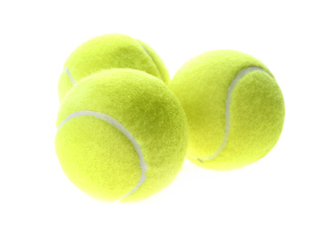 Photo of Bright yellow tennis balls isolated on white