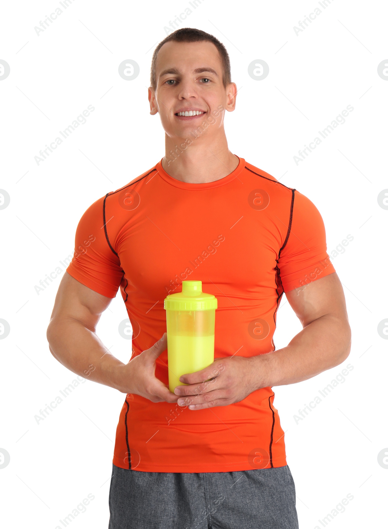 Photo of Athletic young man with protein shake on white background