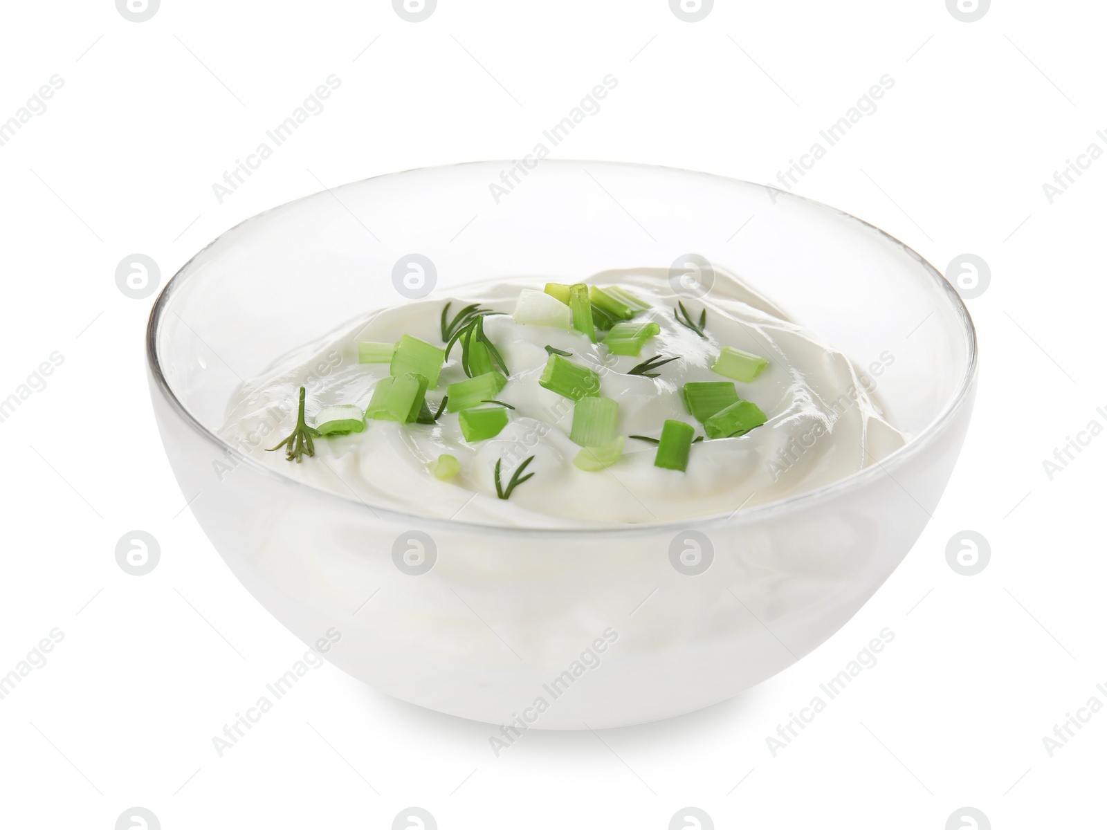 Photo of Bowl with sour cream and herbs on white background