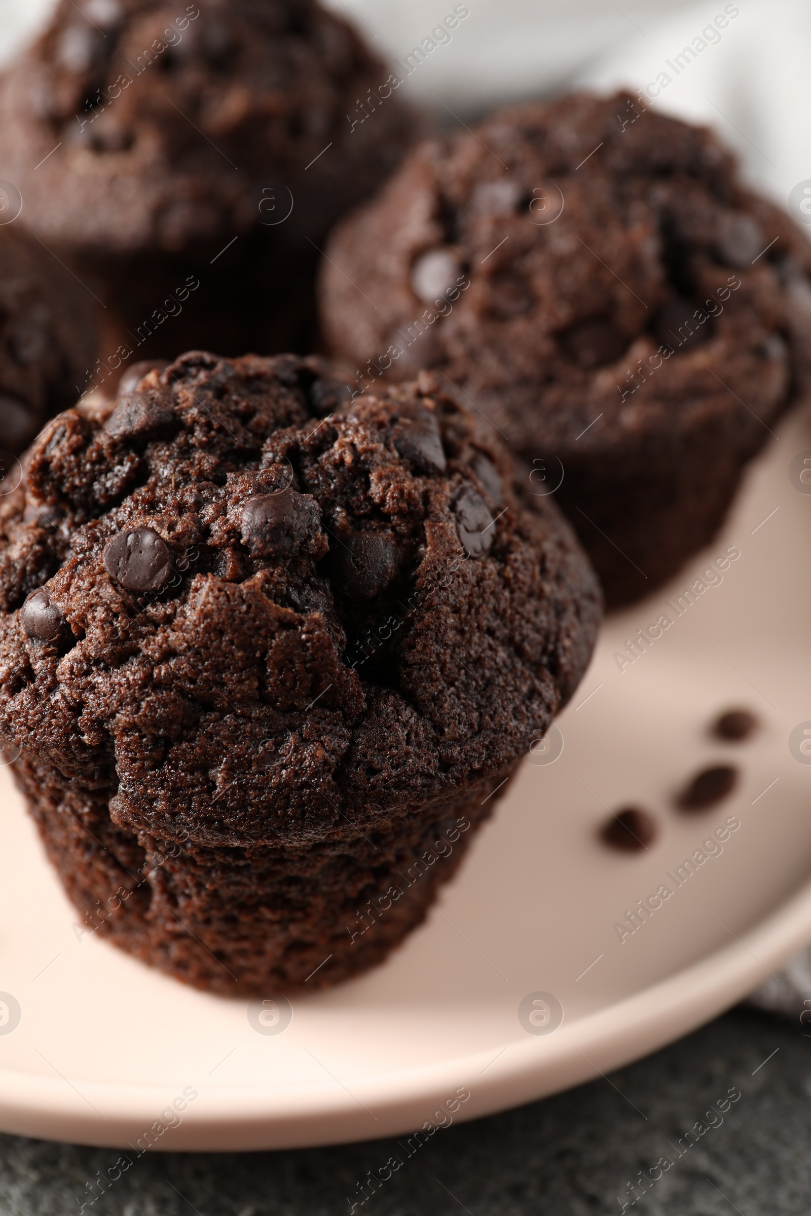 Photo of Delicious fresh chocolate muffins on table, closeup