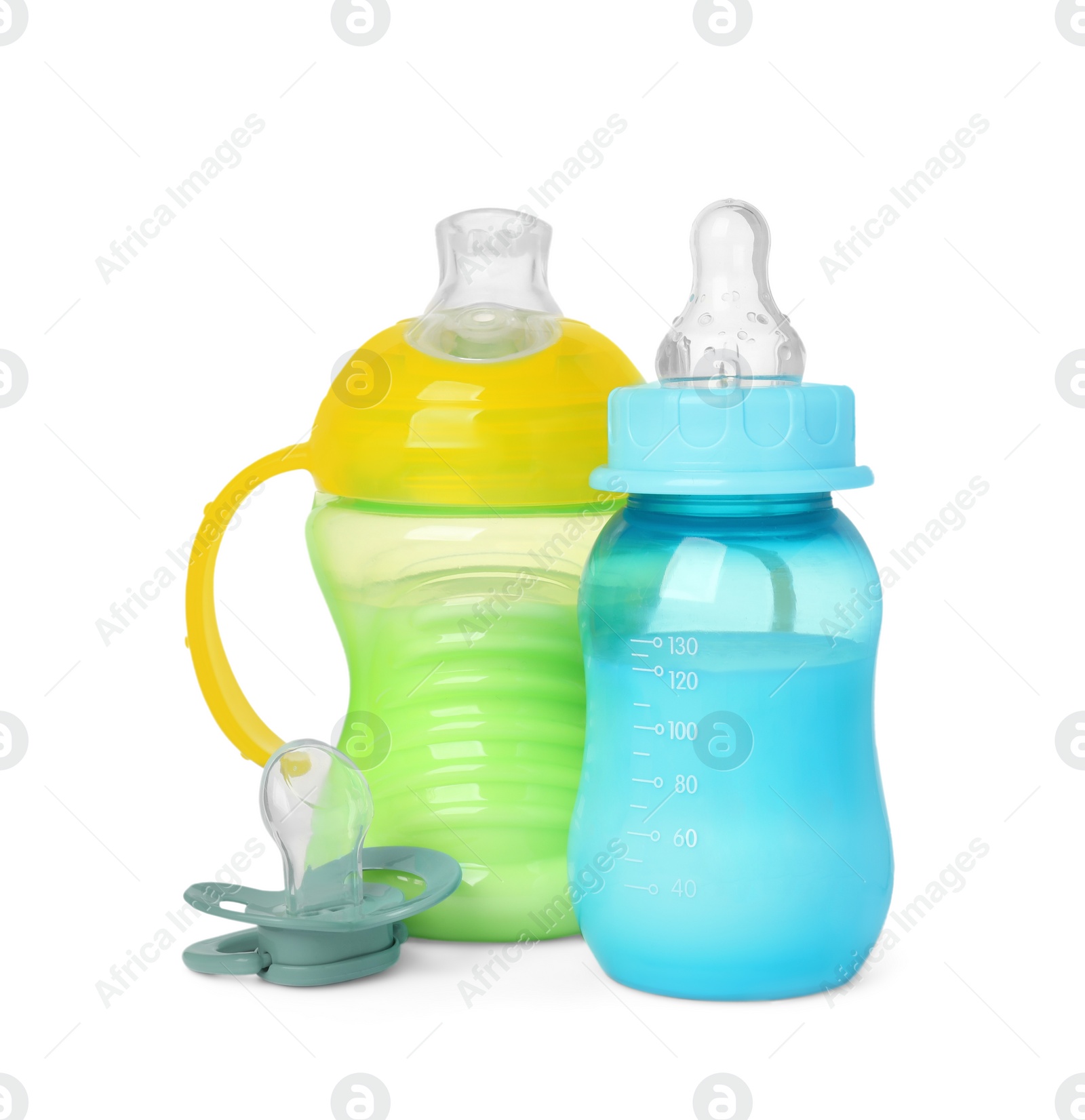 Photo of Feeding bottles with milk and pacifier on white background