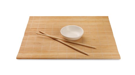 Photo of Bamboo mat, bowl and chopsticks isolated on white