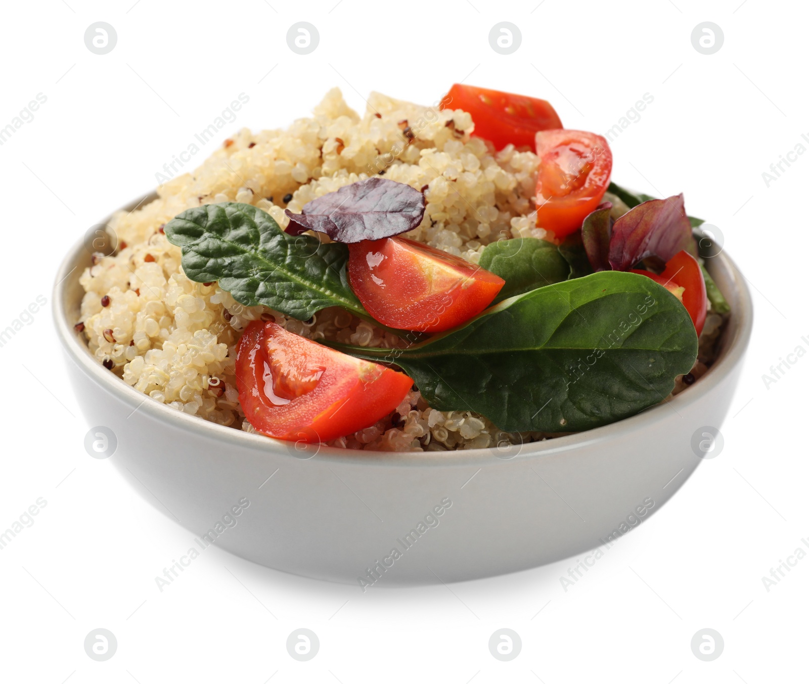 Photo of Tasty quinoa porridge with tomatoes and spinach in bowl isolated on white