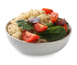 Photo of Tasty quinoa porridge with tomatoes and spinach in bowl isolated on white