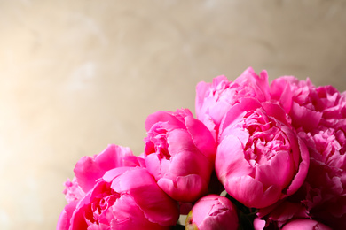 Photo of Beautiful peony bouquet on grey background. Space for text