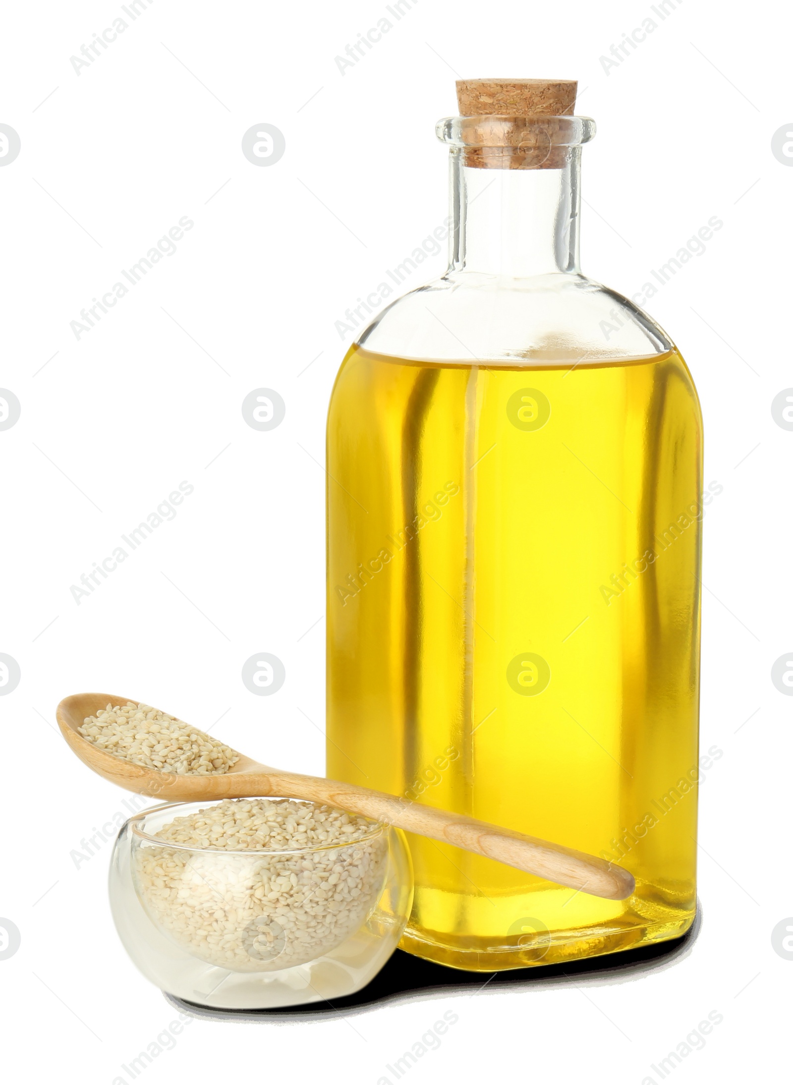 Photo of Vegetable fats. Sesame oil in glass bottle and seeds isolated on white