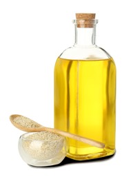 Photo of Vegetable fats. Sesame oil in glass bottle and seeds isolated on white