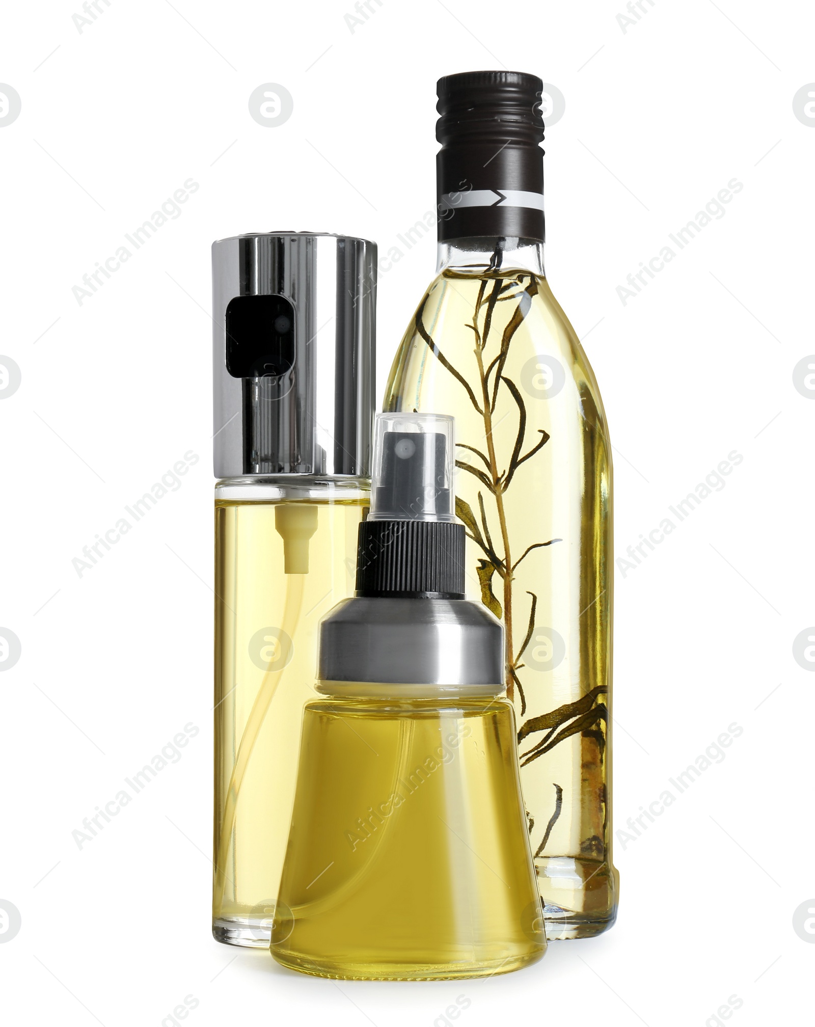 Photo of Bottles of cooking oil on white background