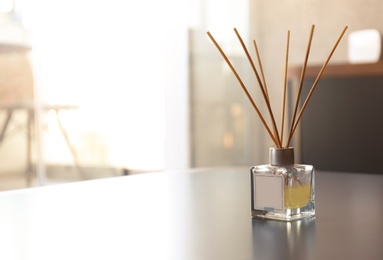 Photo of Reed air freshener on table in room