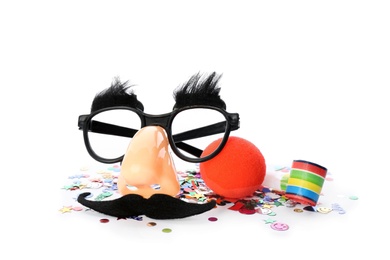 Photo of Clown nose, funny glasses and party blower on white background
