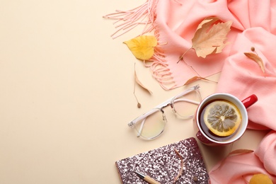 Flat lay composition with hot drink on beige background, space for text. Cozy autumn