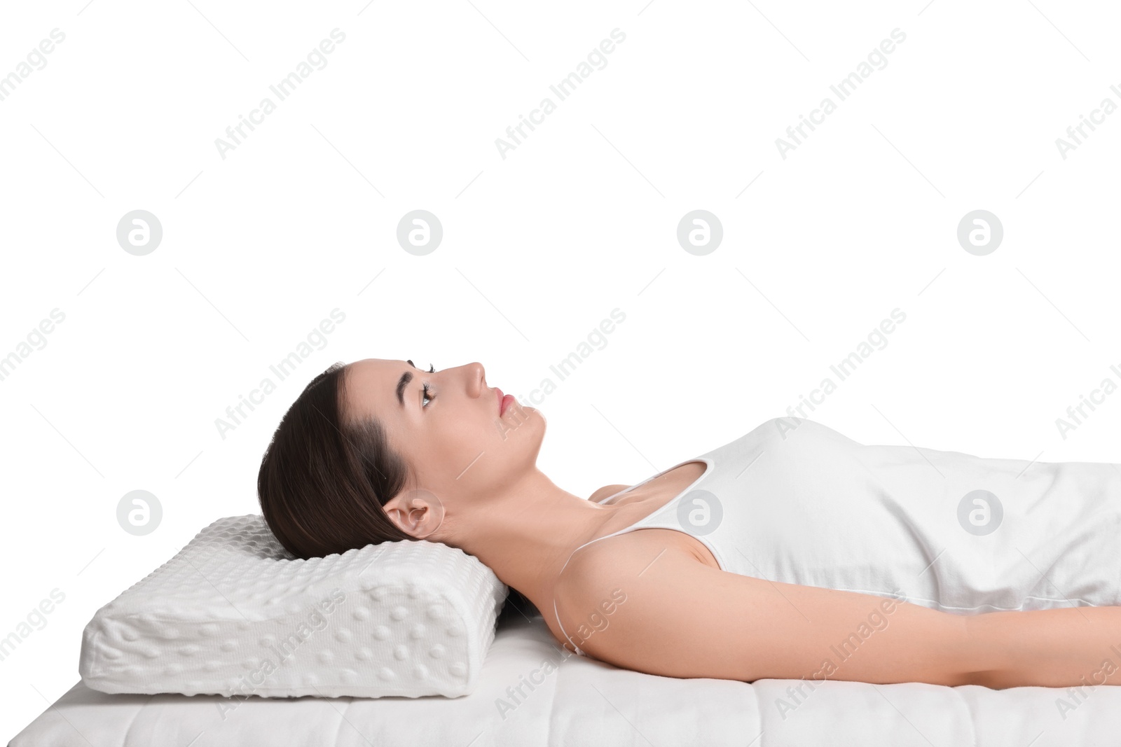 Photo of Woman lying on orthopedic pillow against white background