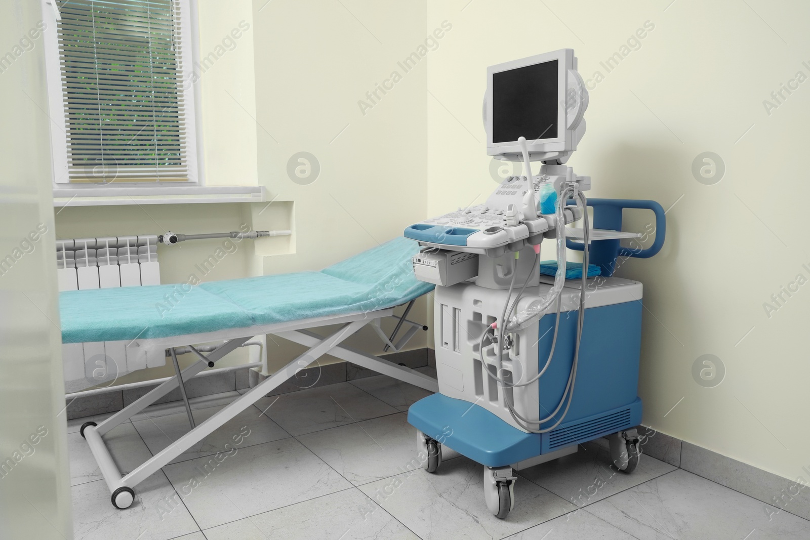 Photo of Ultrasound machine and examination table in hospital